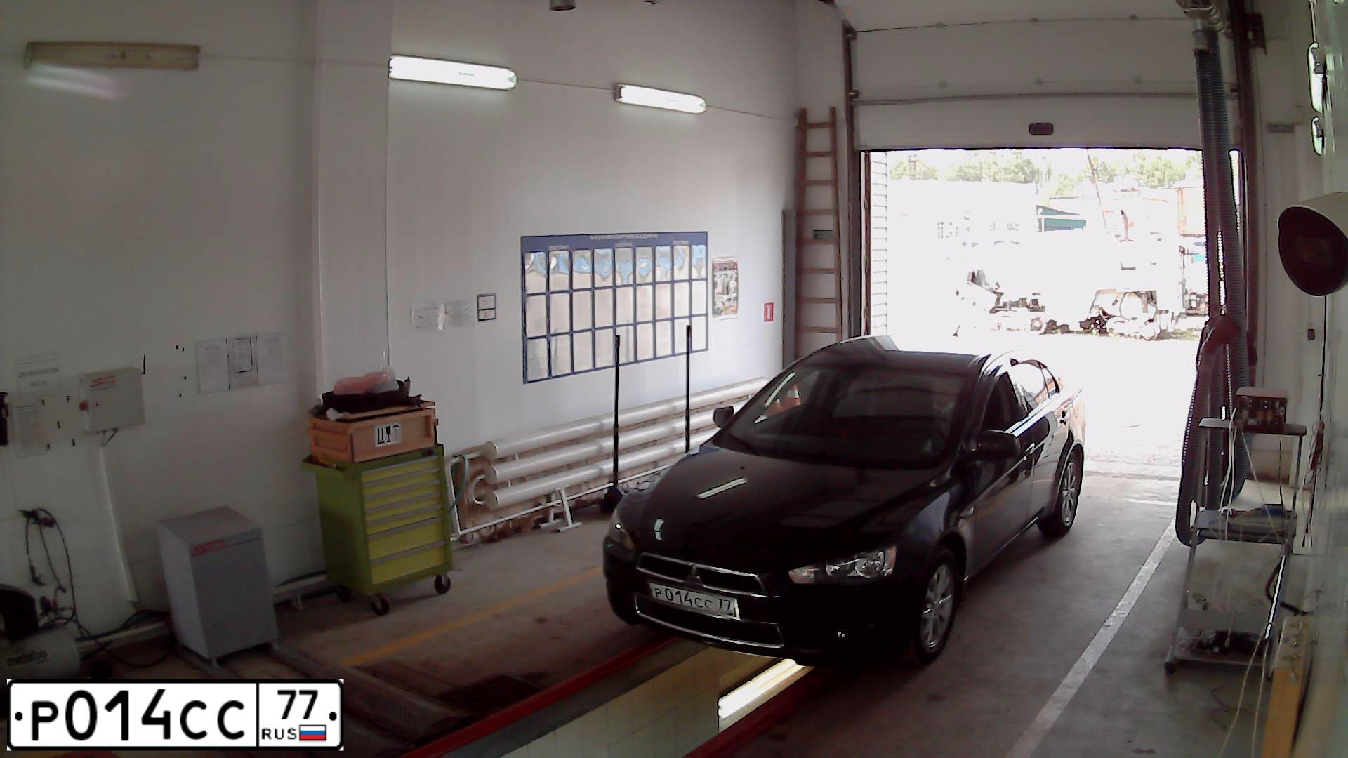 Фото автомобиля MITSUBISHI LANCER, 2010 — госномер Р014СС77. Цвет: ЧЕРНЫЙ