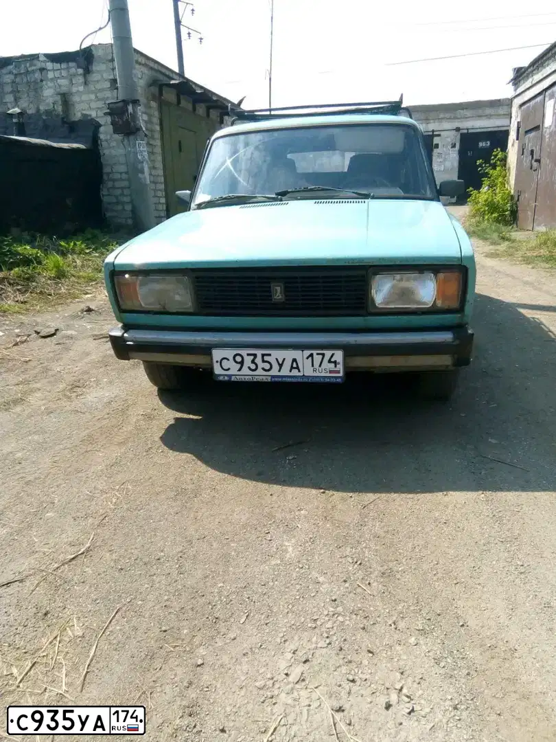 Фото автомобиля LADA 2104, 2000 — госномер С935УА174. Цвет: СЕРО-ЗЕЛЕНО-ГОЛУБОЙ