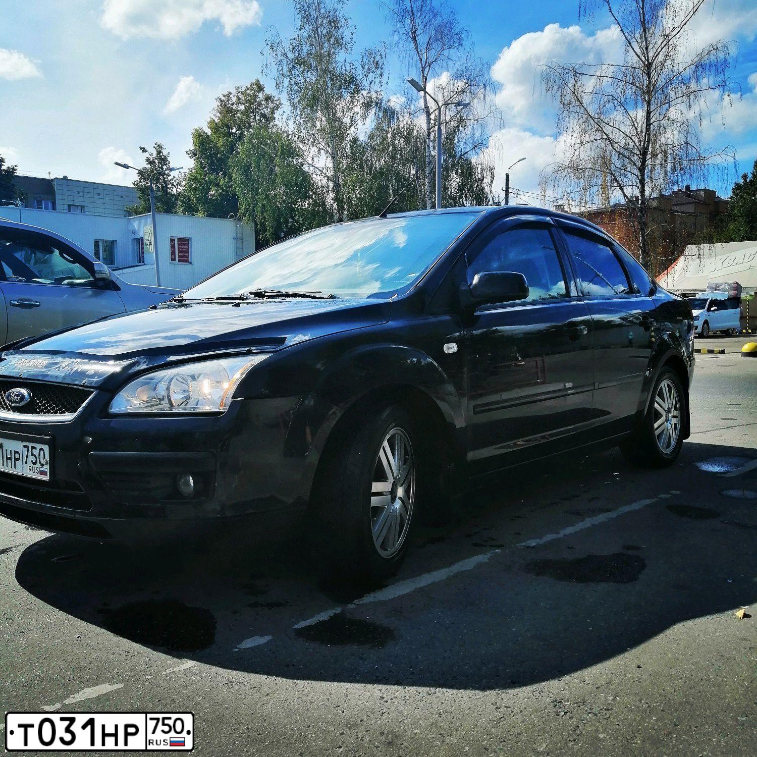 Фото автомобиля FORD FOCUS, 2006 — госномер Т031НР750. Цвет: ЧЕРНЫЙ