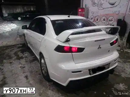 Фото автомобиля MITSUBISHI LANCER, 2007 — госномер М619ОВ29. Цвет: Белый