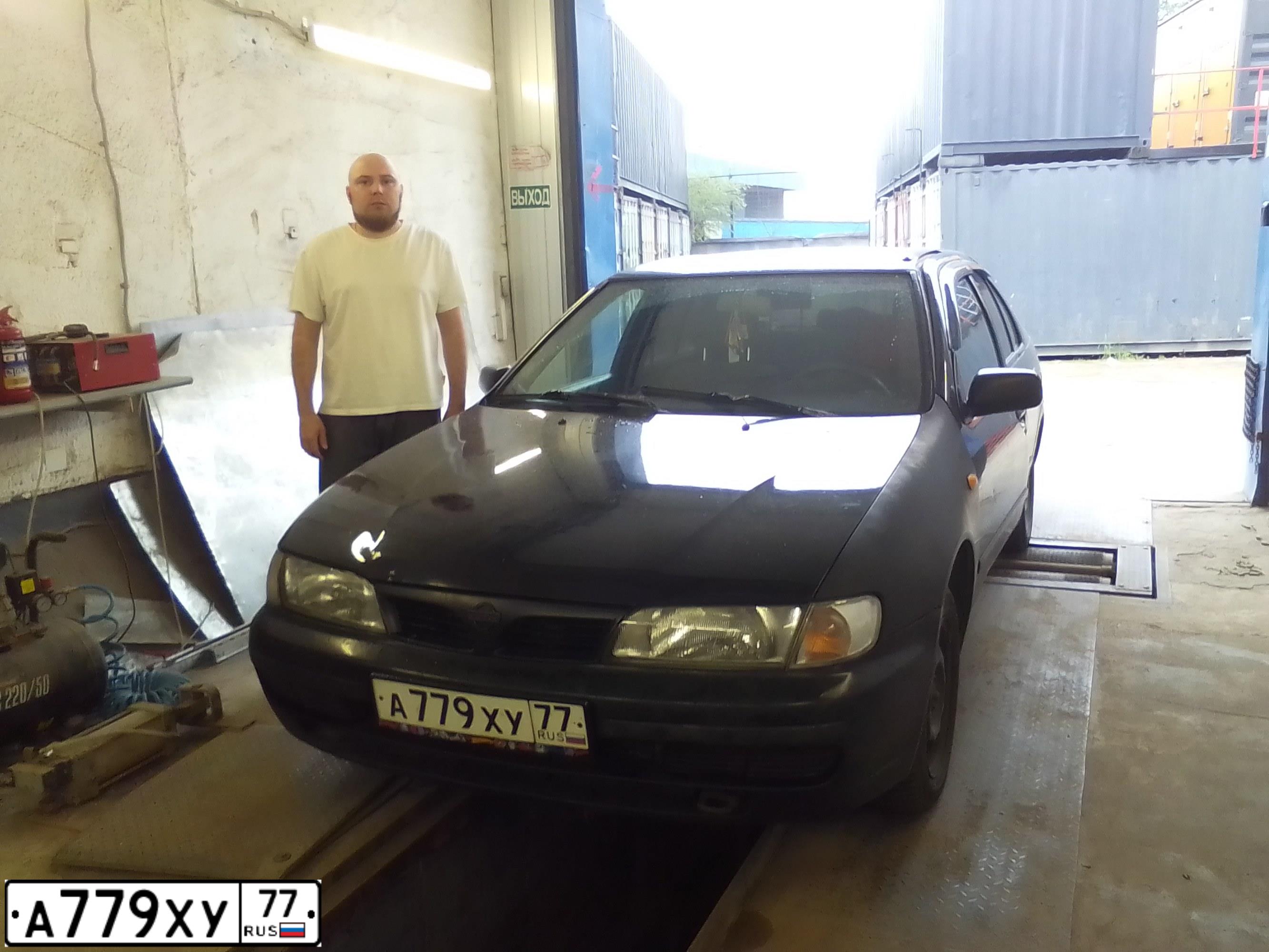 Фото автомобиля NISSAN ALMERA, 1998 — госномер А779ХУ77. Цвет: ЧЕРНЫЙ