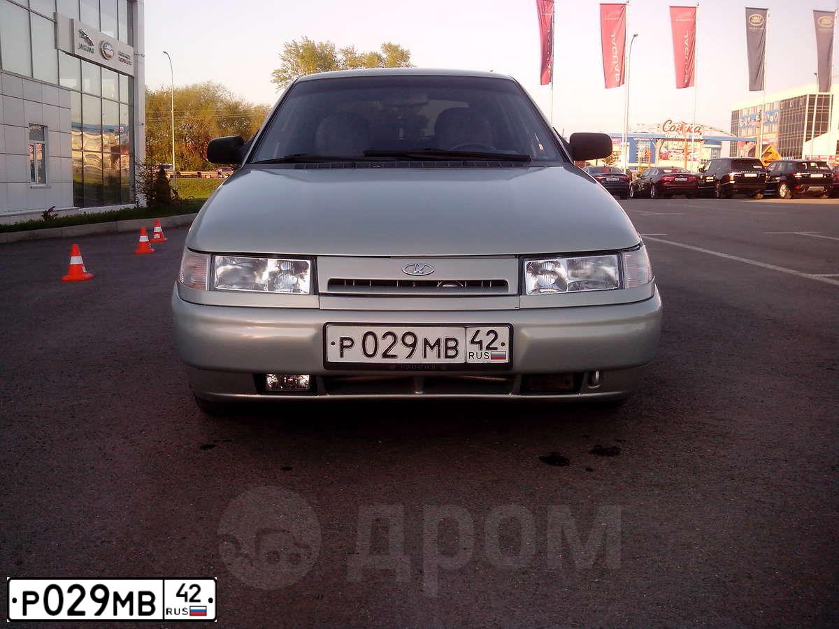 Фото автомобиля LADA 2112, 2002 — госномер Т300НТ142. Цвет: СЕРЕБРИСТЫЙ ЖЕЛТО-ЗЕЛЕНЫЙ