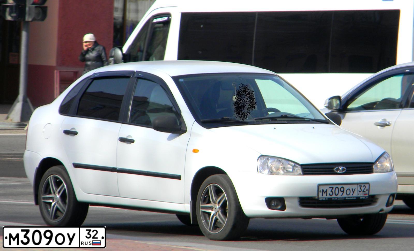 Фото автомобиля LADA 1118 KALINA, 2009 — госномер М309ОУ32. Цвет: БЕЛЫЙ-ЧЕРНЫЙ