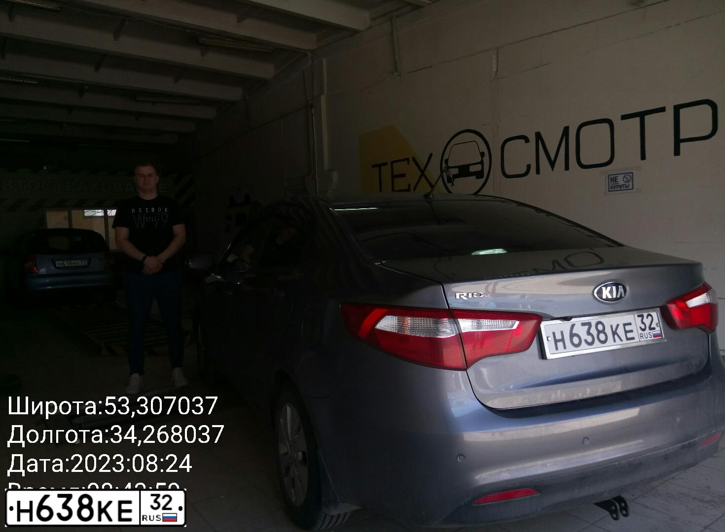 Фото автомобиля KIA RIO, 2013 — госномер Е027ТК32. Цвет: СЕРЫЙ