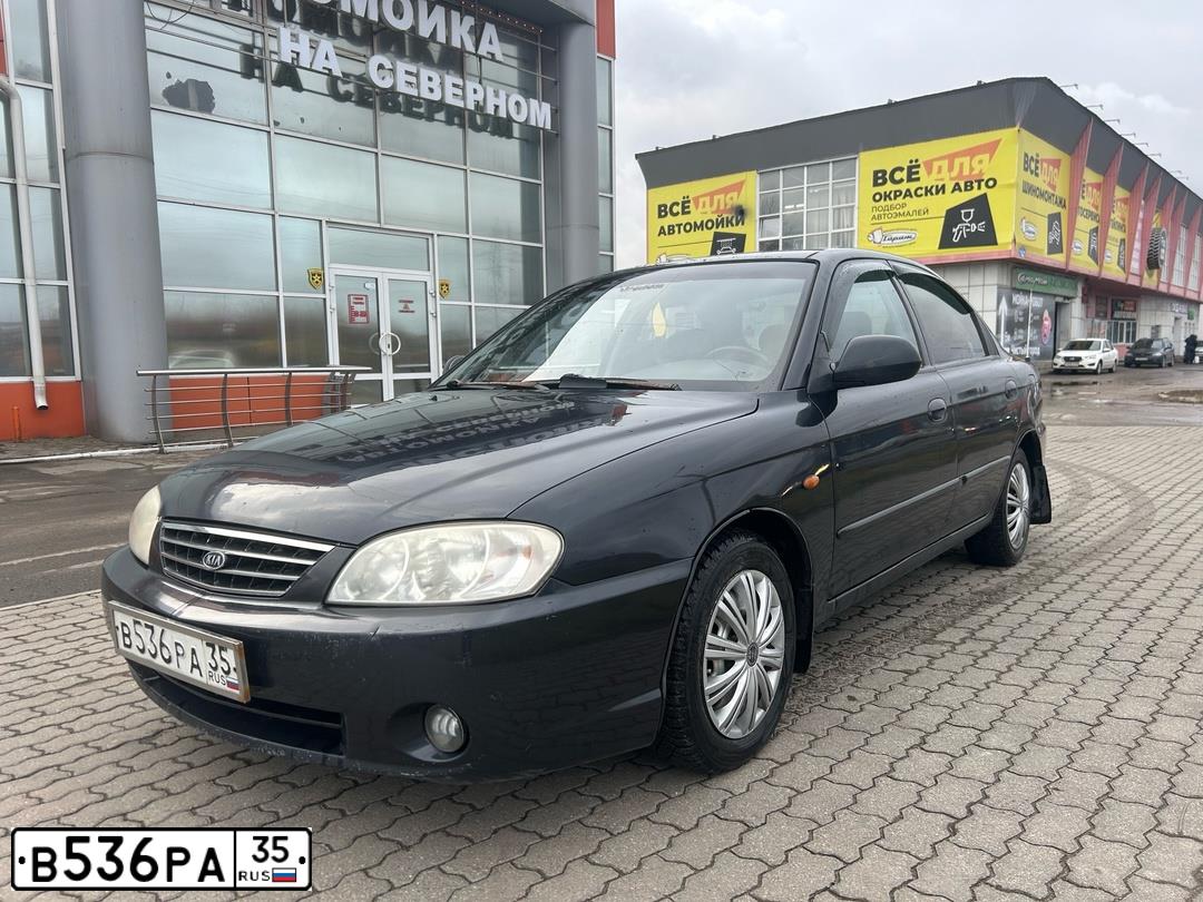 Фото автомобиля KIA SPECTRA, 2006 — госномер Н087ТЕ35. Цвет: ЧЕРНЫЙ
