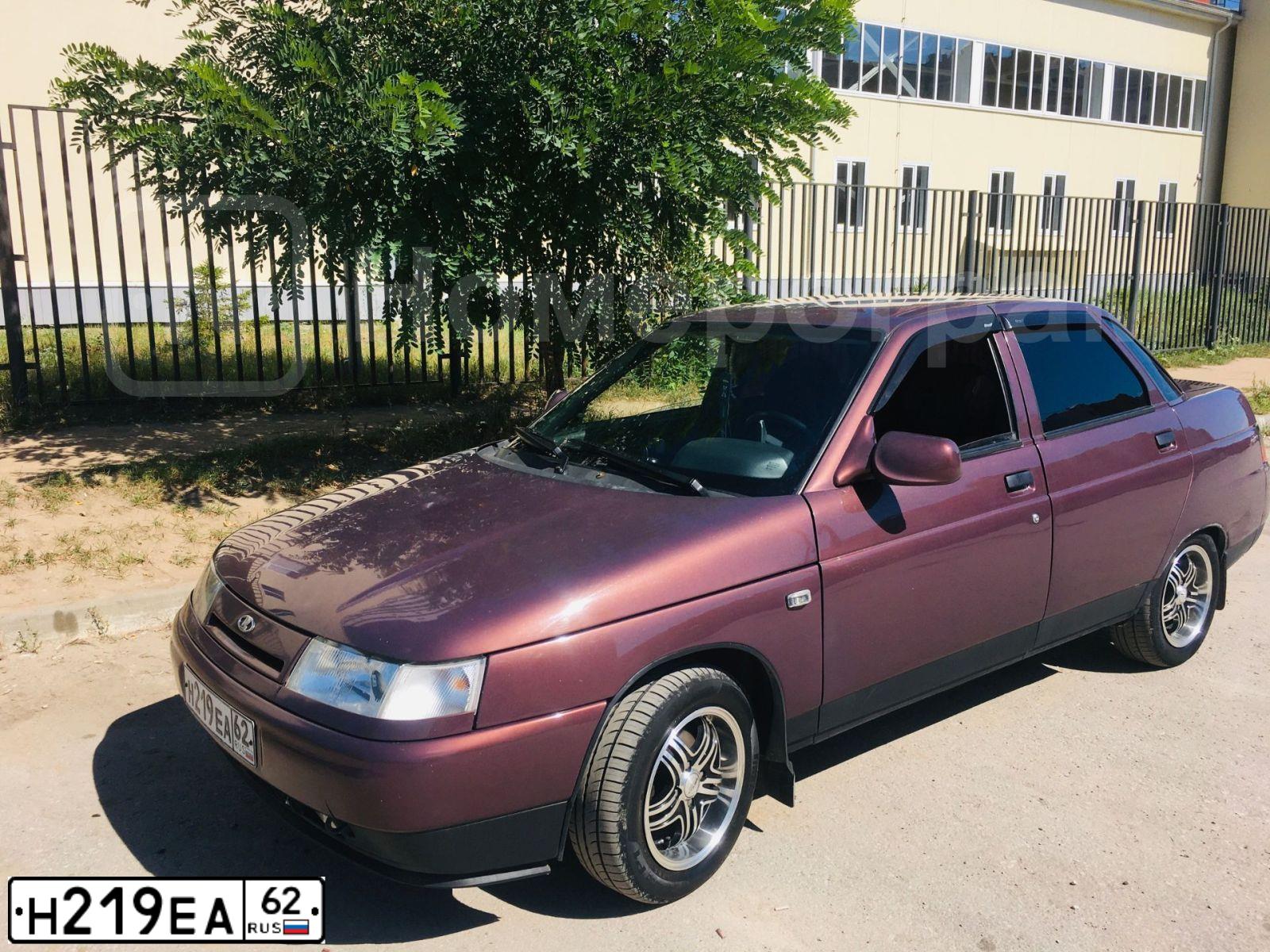 Фото автомобиля LADA 2110, 2003 — госномер Н219ЕА62. Цвет: Золотистый Красно-коричневый