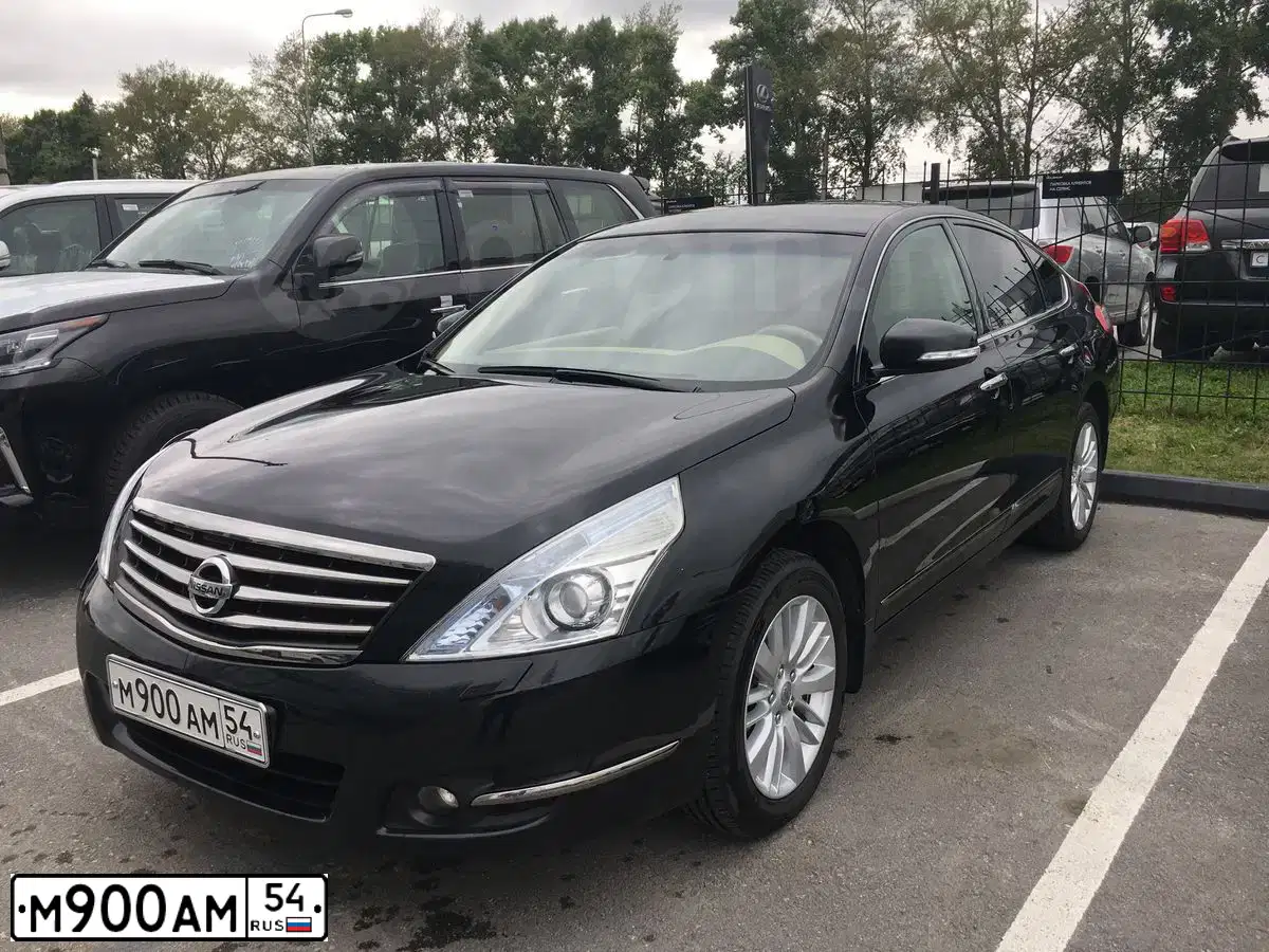 Фото автомобиля NISSAN TEANA, 2011 — госномер О600УА70. Цвет: ЧЕРНЫЙ