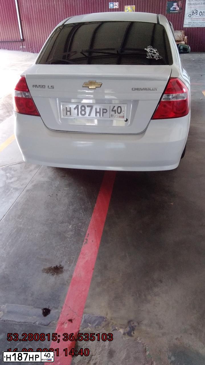 Фото автомобиля CHEVROLET AVEO, 2011 — госномер Н187НР40. Цвет: Белый