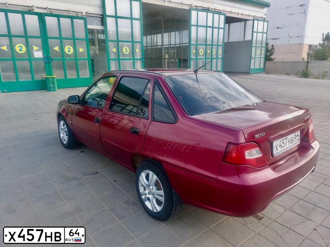 Фото автомобиля DAEWOO NEXIA, 2011 — госномер М708МО164. Цвет: СПЕЛАЯ ВИШНЯ