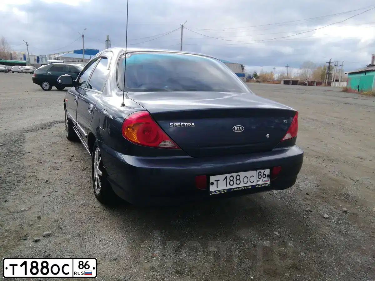 Фото автомобиля KIA SPECTRA, 2006 — госномер Т188ОС86. Цвет: мерцающий синий (синий)