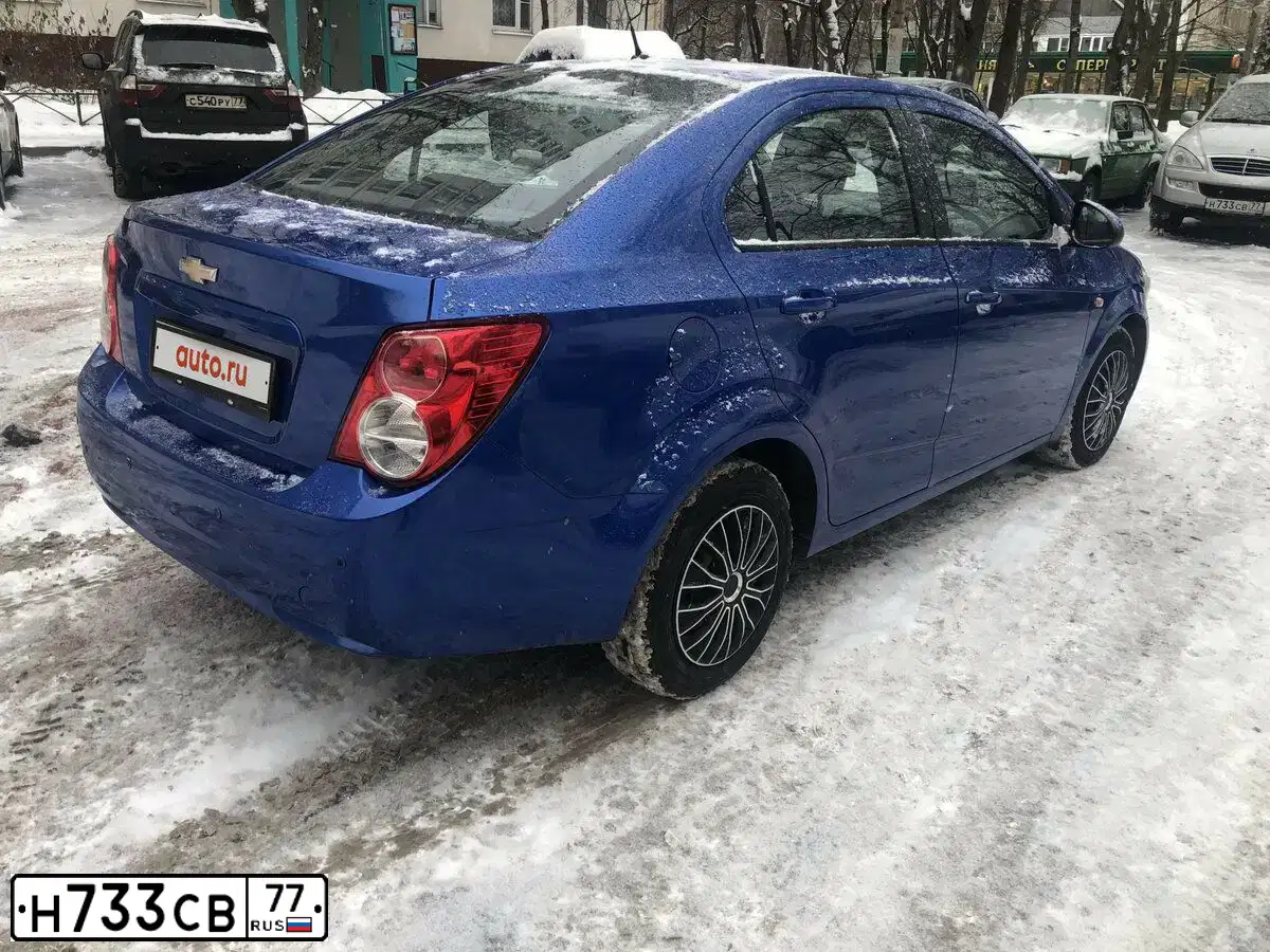 Фото автомобиля SSANGYONG KYRON, 2012 — госномер Н733СВ77. Цвет: Серебристый