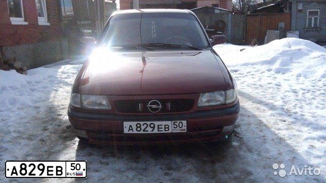 Фото автомобиля OPEL ASTRA, 1997 — госномер Е837ТЕ150. Цвет: Красный