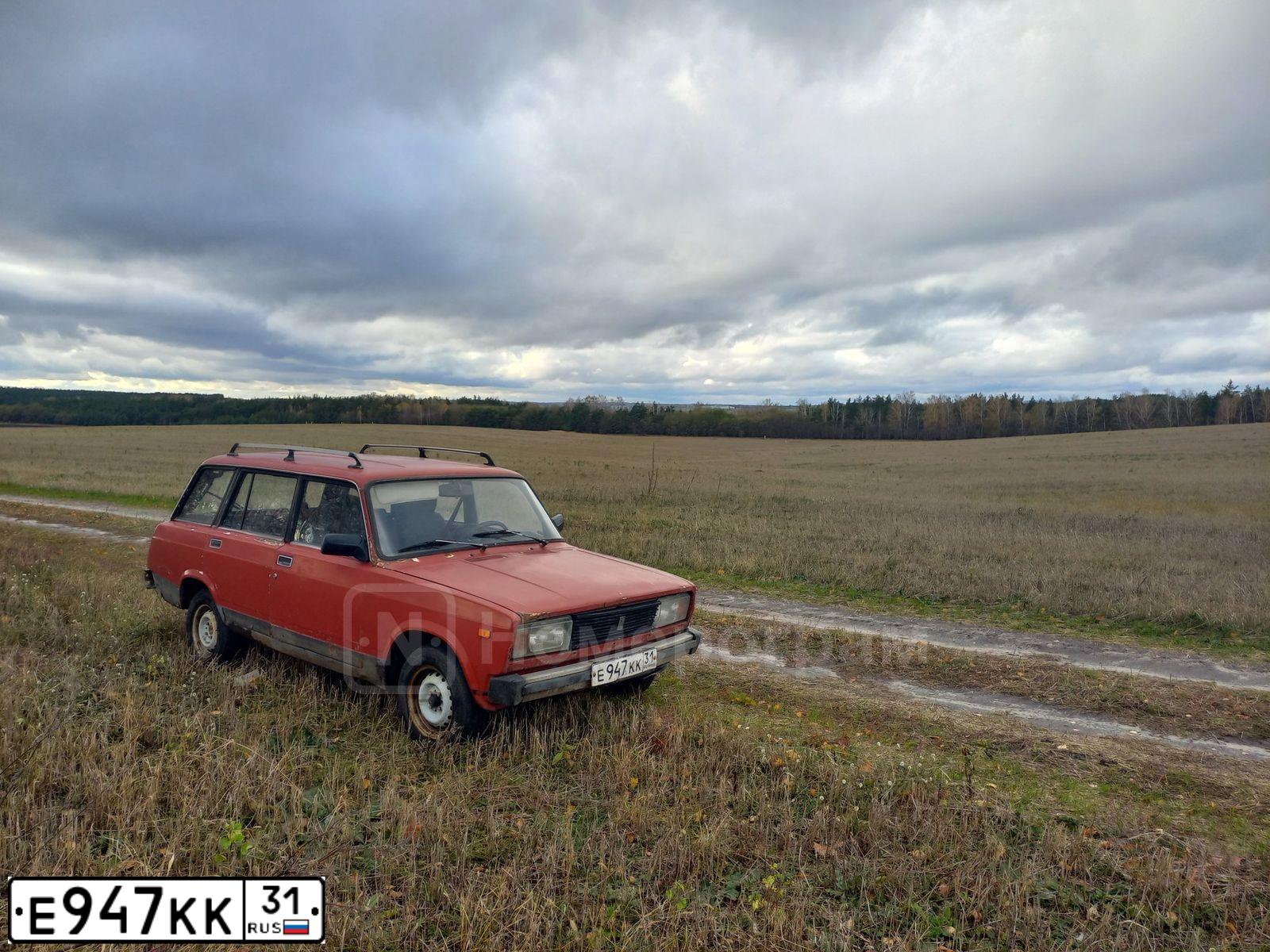 Фото автомобиля LADA 2104, 1989 — госномер Е947КК31. Цвет: КРАСНЫЙ
