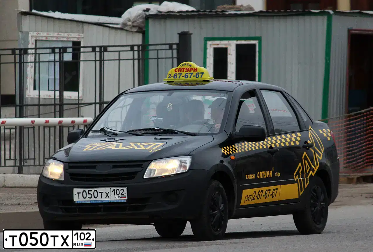 Фото автомобиля LADA 2190 GRANTA, 2012 — госномер М227АЕ702. Цвет: СЕРО-ЧЕРНЫЙ