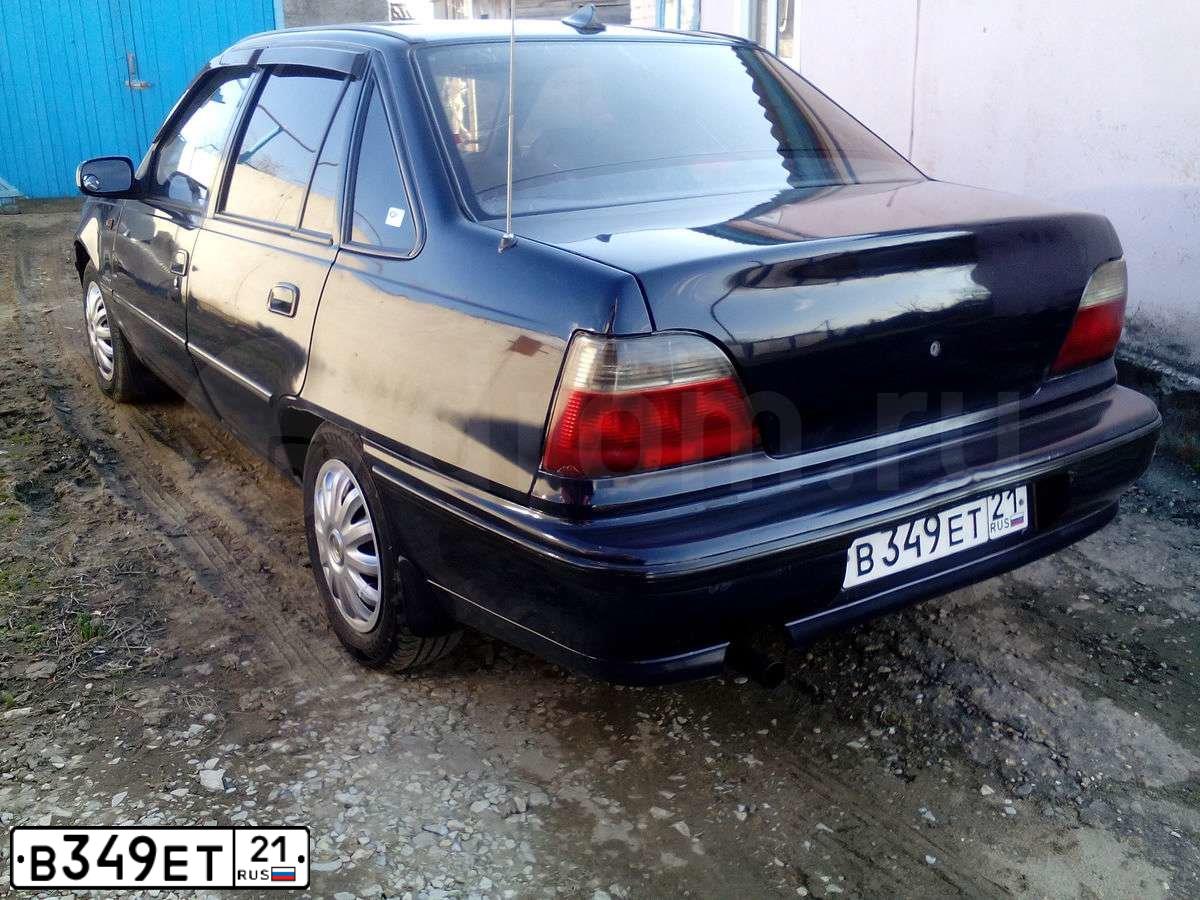 Фото автомобиля DAEWOO NEXIA, 2005 — госномер В349ЕТ21. Цвет: ТЕМНО-СИНИЙ