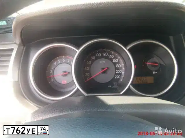 Фото автомобиля NISSAN TIIDA, 2008 — госномер Т762УЕ74. Цвет: Серебристый