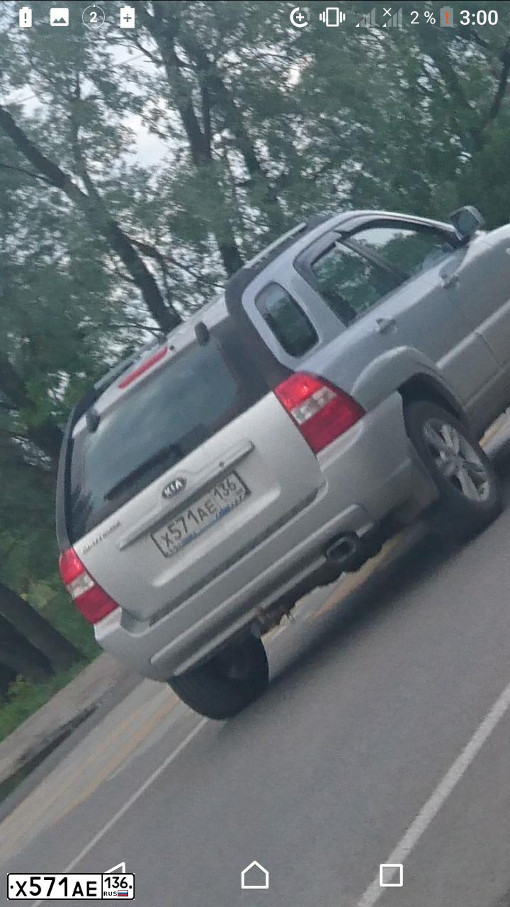 Фото автомобиля KIA SPORTAGE, 2007 — госномер Х571АЕ136. Цвет: СЕРЕБРИСТЫЙ