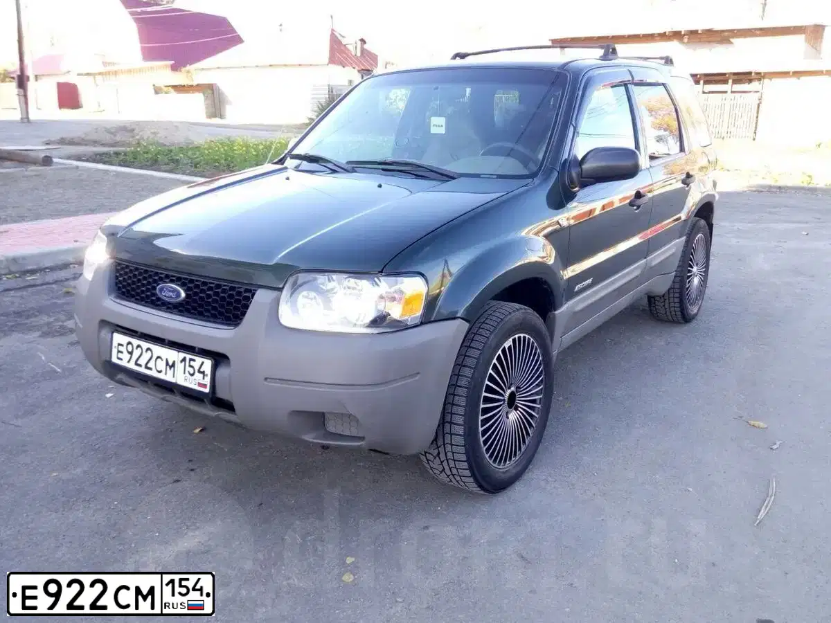 Фото автомобиля FORD ESCAPE, 2001 — госномер Е922СМ154. Цвет: ТЕМНО ЗЕЛЕНЫЙ