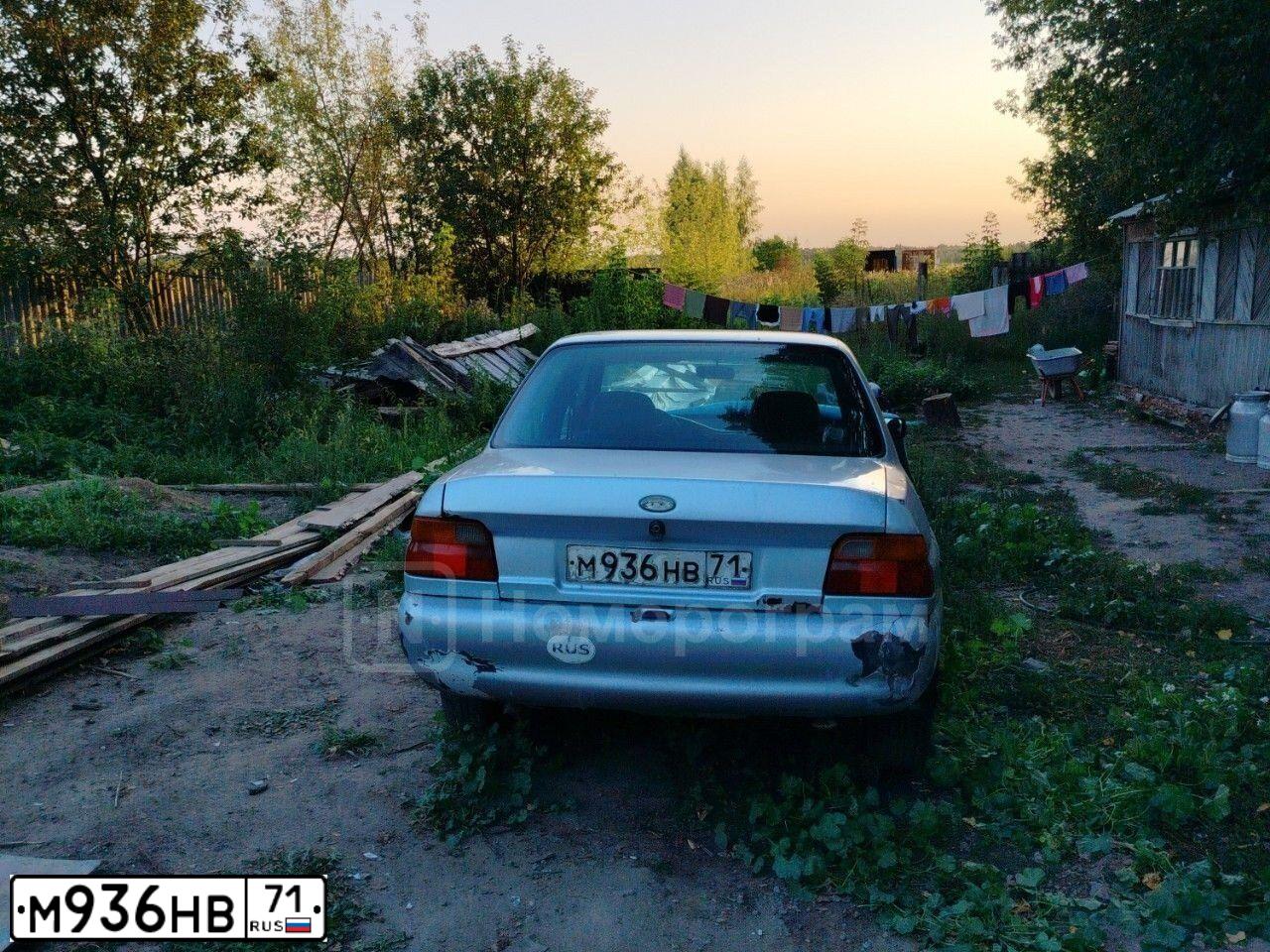 Фото автомобиля FORD ESCORT, 1996 — госномер М936НВ71. Цвет: СЕРЫЙ