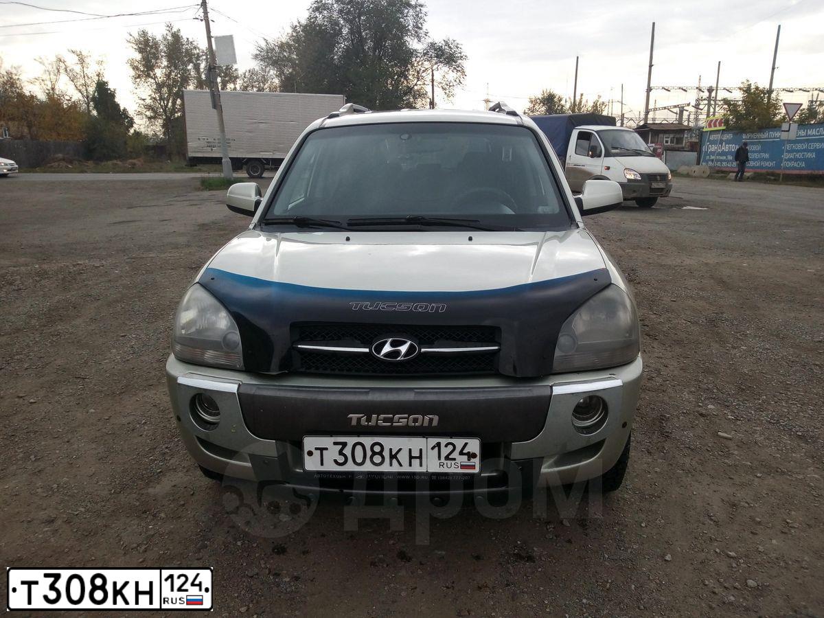 Фото автомобиля HYUNDAI TUCSON, 2007 — госномер С170АТ124. Цвет: серебристый