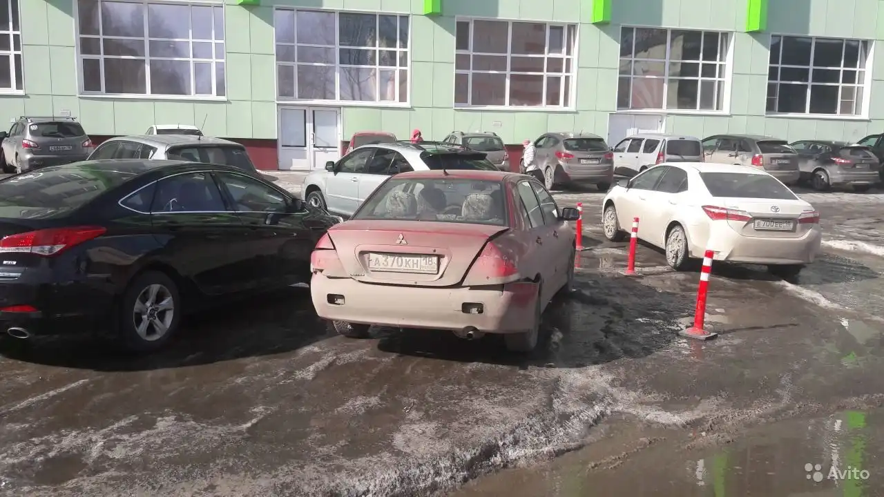 Фото автомобиля MITSUBISHI LANCER, 2004 — госномер А370КН18. Цвет: Красный