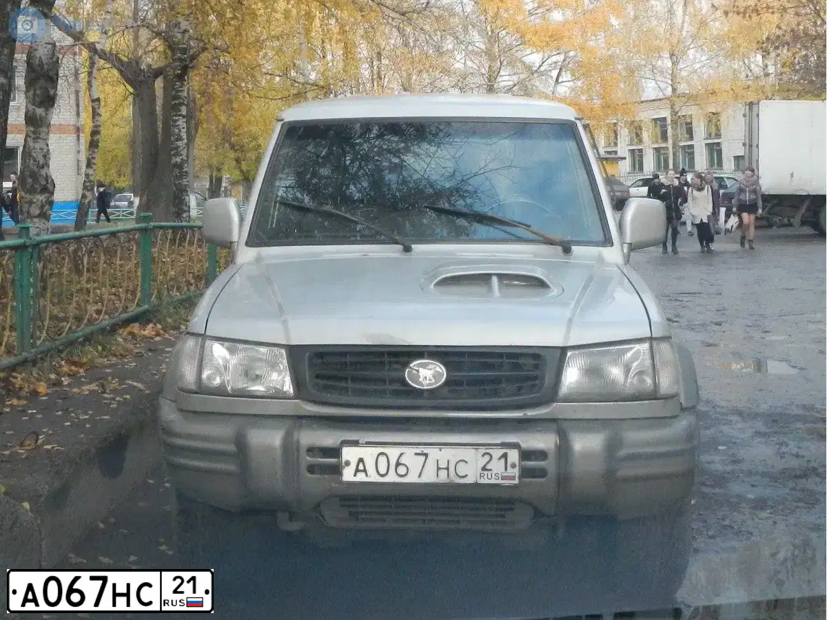 Фото автомобиля HYUNDAI GALLOPER, 1999 — госномер А067НС21. Цвет: СЕРЫЙ