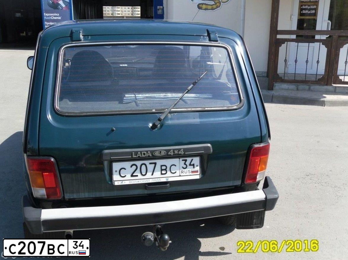 Фото автомобиля LADA 2121 NIVA, 2011 — госномер Е849КС134. Цвет: ТЕМНО ЗЕЛЕНЫЙ
