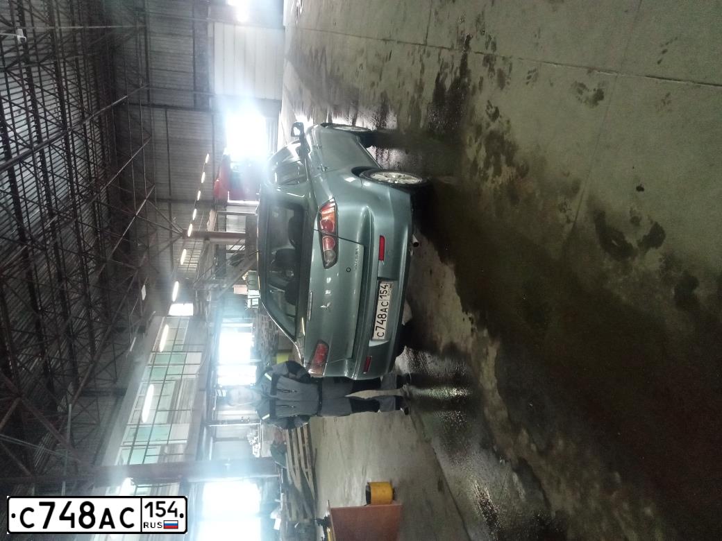 Фото автомобиля MITSUBISHI LANCER, 2010 — госномер С748АС154. Цвет: СВЕТЛО-СЕРО-ЗЕЛЕНЫЙ