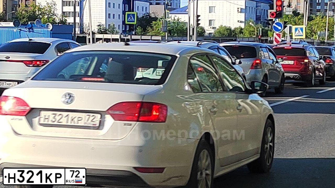 Фото автомобиля FORD FOCUS, 2011 — госномер Н321КР72. Цвет: ЧЕРНЫЙ
