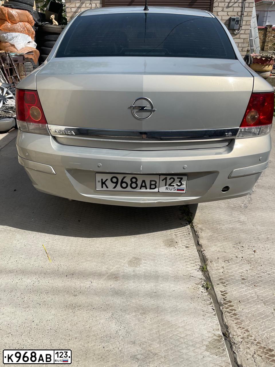 Фото автомобиля OPEL ASTRA, 2007 — госномер Р149АА82. Цвет: БЕЖЕВО-СЕРЫЙ