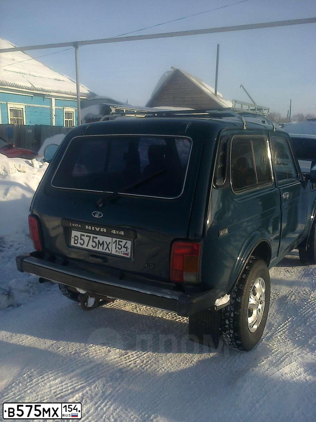 Фото автомобиля LADA 2121 NIVA, 2001 — госномер В575МХ154. Цвет: СИНЕ ЗЕЛЕНЫЙ