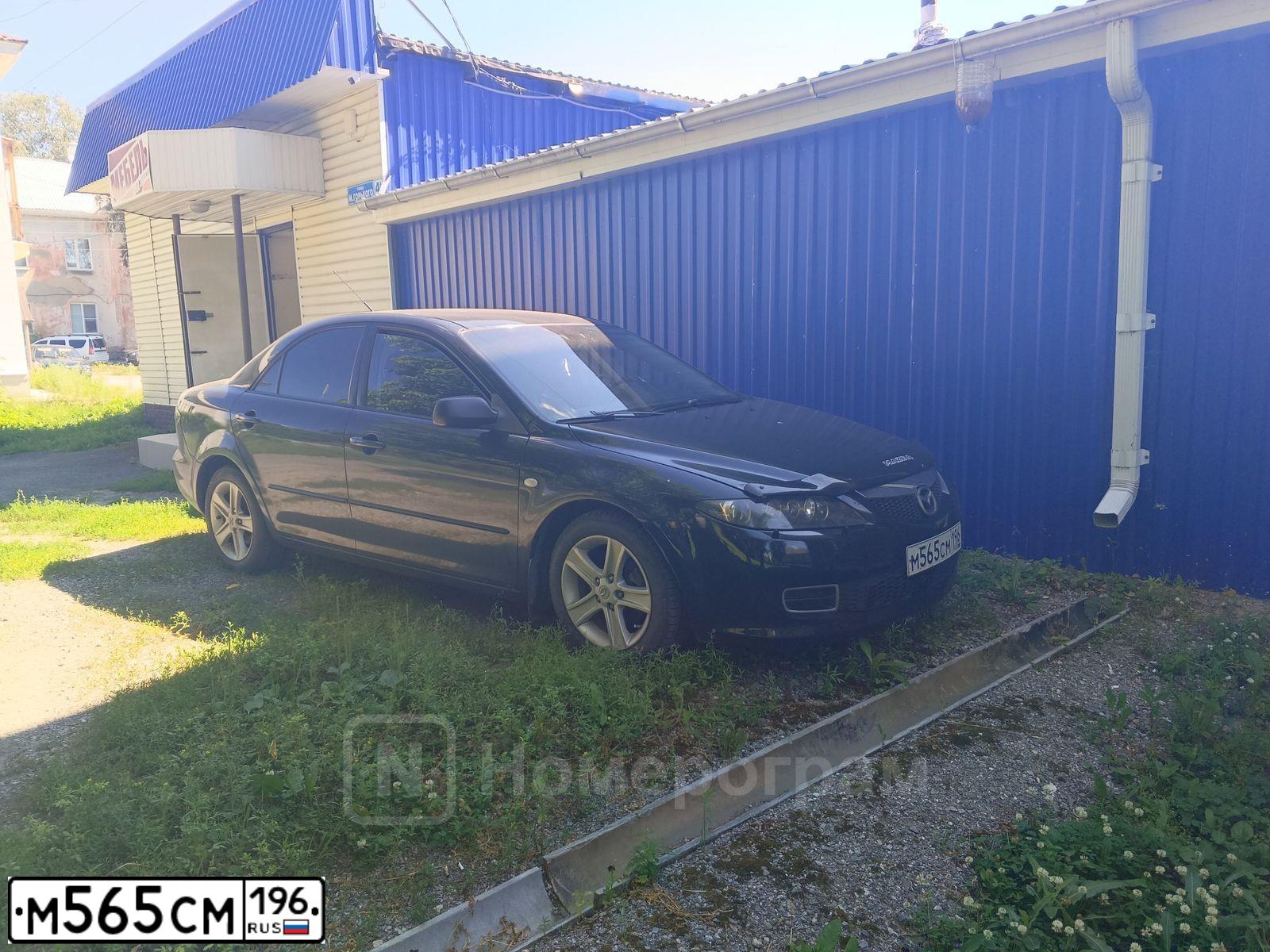 Фото автомобиля MAZDA 6, 2005 — госномер М565СМ196. Цвет: ЧЕРНО-ЗЕЛЕНЫЙ
