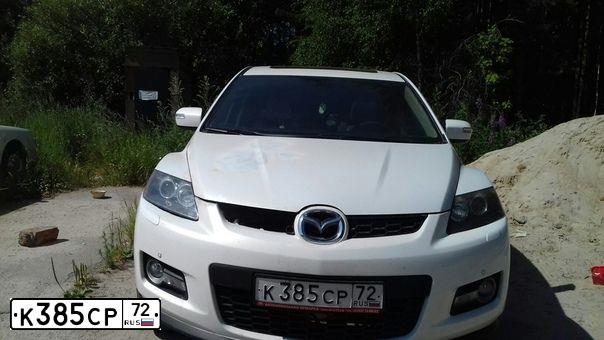 Фото автомобиля MAZDA CX-7, 2008 — госномер Е846НВ45. Цвет: Белый