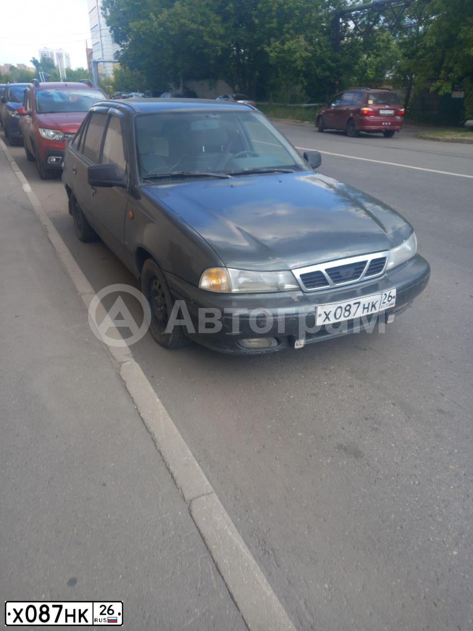 Фото автомобиля DAEWOO NEXIA, 2004 — госномер Е894УЕ33. Цвет: Темно-зеленый
