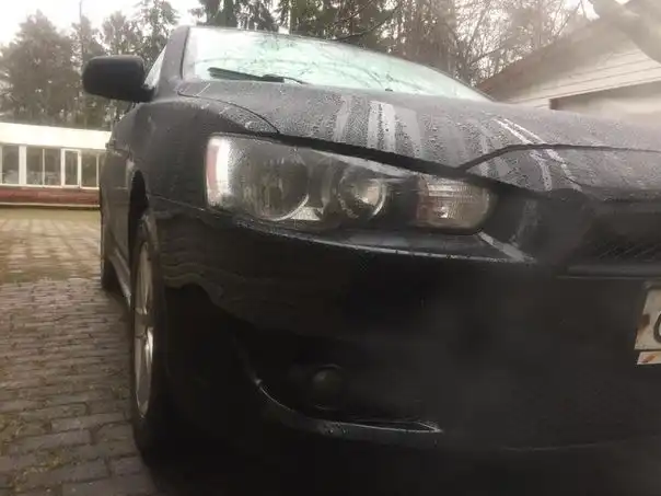 Фото автомобиля MITSUBISHI LANCER, 2007 — госномер А828ЕМ252. Цвет: ЧЕРНЫЙ