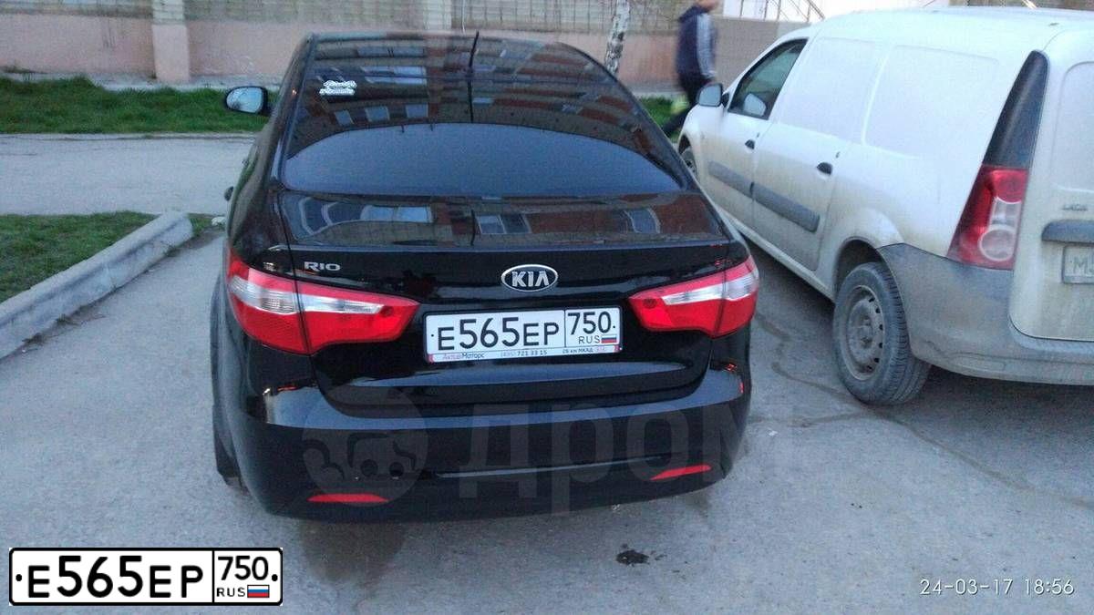 Фото автомобиля KIA RIO, 2014 — госномер Е565ЕР750. Цвет: ЧЕРНЫЙ