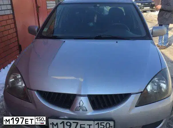 Фото автомобиля MITSUBISHI LANCER, 2005 — госномер М197ЕТ150. Цвет: СЕРЕБРИСТЫЙ