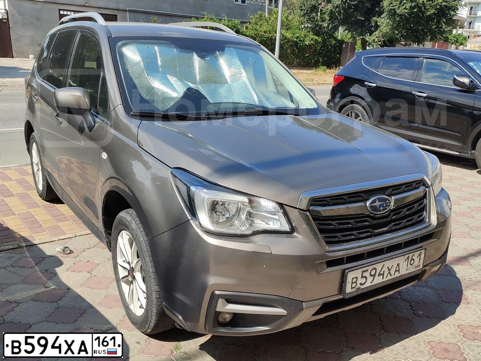 Фото автомобиля SUBARU FORESTER, 2016 — госномер В594ХА161. Цвет: СЕРО-БЕЖЕВЫЙ