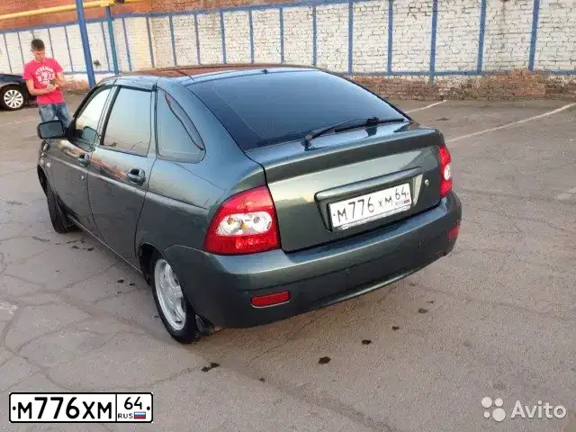 Фото автомобиля LADA 2112 LADA, 2001 — госномер Т988КК30. Цвет: СЕРЕБРИСТО-СЕРО-ЗЕЛЕНЫЙ
