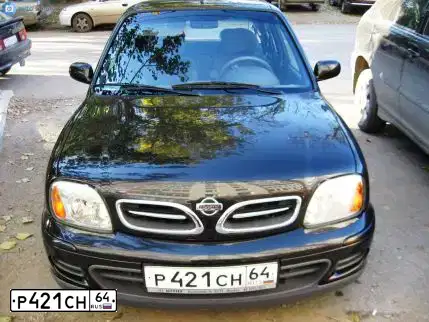 Фото автомобиля NISSAN MICRA, 2002 — госномер Т145РЕ64. Цвет: ЧЕРНЫЙ