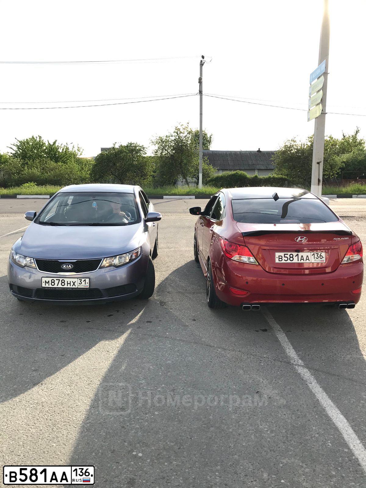 Фото автомобиля HYUNDAI SOLARIS, 2011 — госномер Т985КТ31. Цвет: КРАСНЫЙ ГРАНАТ
