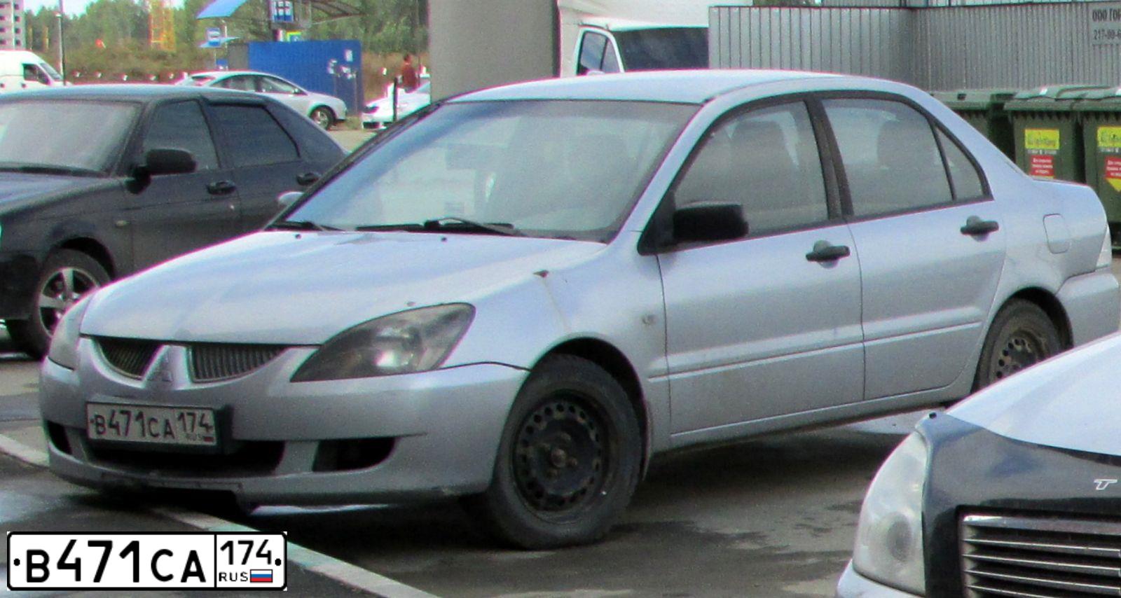 Фото автомобиля MITSUBISHI LANCER, 2003 — госномер Е166ХХ199. Цвет: Серебристый