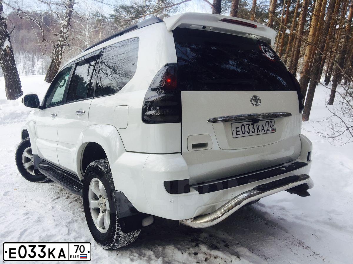 Фото автомобиля TOYOTA LANDCRUISER, 2007 — госномер Е033КА70. Цвет: Белый