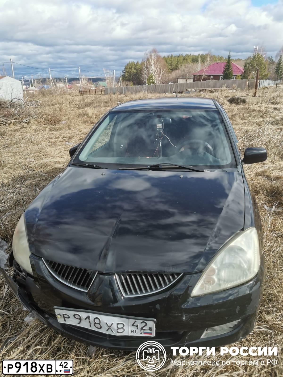 Фото автомобиля MITSUBISHI LANCER, 2004 — госномер Р918ХВ42. Цвет: ЧЕРНЫЙ