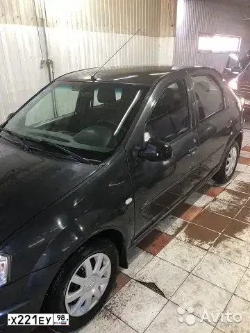 Фото автомобиля RENAULT LOGAN, 2010 — госномер Е140МХ53. Цвет: ТЕМНО СЕРЫЙ МЕТАЛЛИК