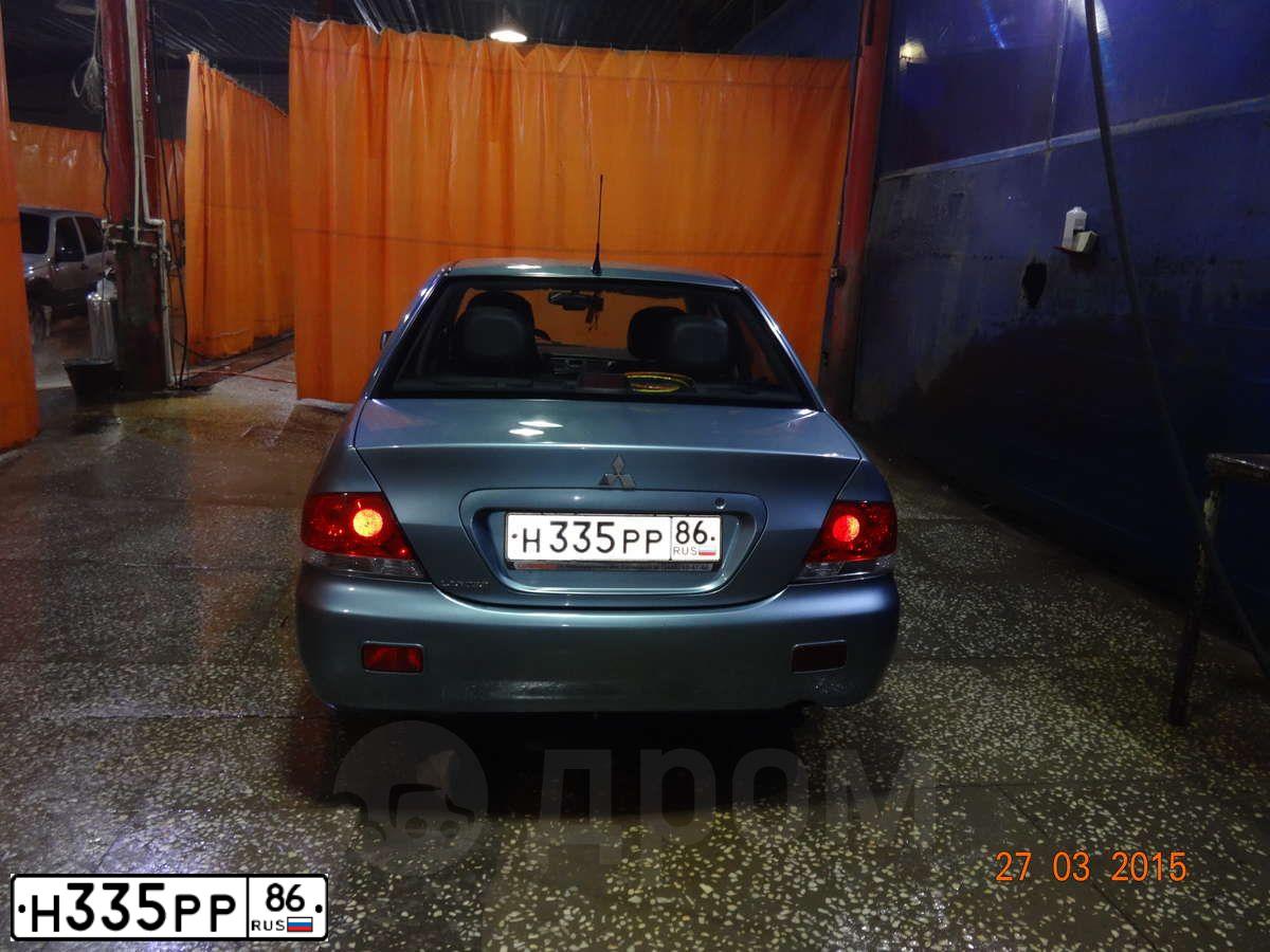 Фото автомобиля MITSUBISHI LANCER, 2007 — госномер Н335РР86. Цвет: СВЕТЛО-СЕРО-ЗЕЛЕНЫЙ