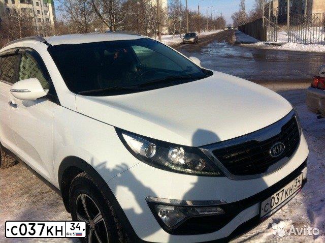 Фото автомобиля KIA SPORTAGE, 2011 — госномер Р509МХ30. Цвет: Белый