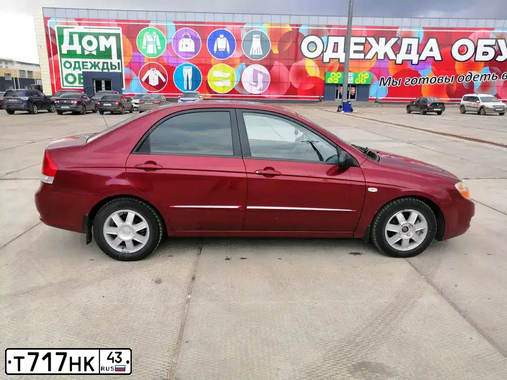 Фото автомобиля KIA CERATO, 2006 — госномер Т717НК43. Цвет: СПЕЛАЯ ВИШНЯ