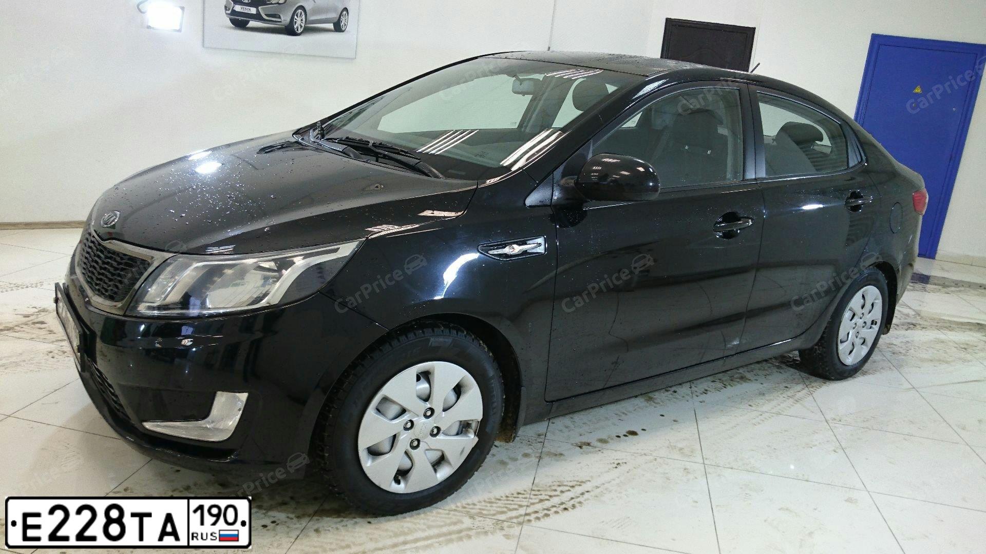 Фото автомобиля KIA RIO, 2012 — госномер Р115ВХ152. Цвет: ЧЕРНЫЙ