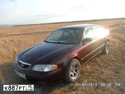Фото автомобиля MAZDA 626, 2002 — госномер К887РТ75. Цвет: БОРДОВЫЙ